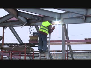 the roof of a house damaged by fire is being restored in vyborg